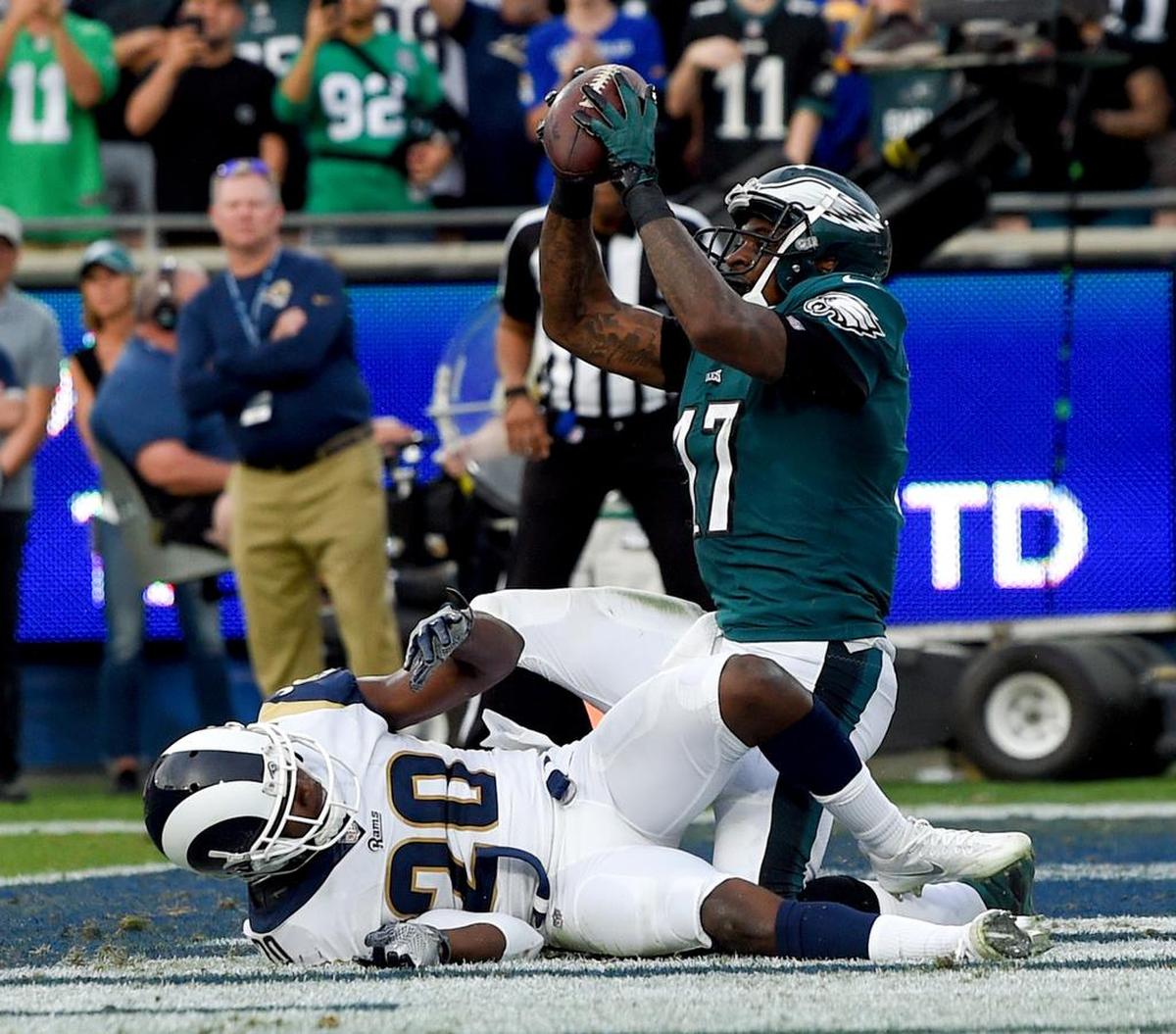 Philadelphia Eagles wide receiver Alshon Jeffery catches a touchdown pass over Los Angeles Rams free safety Lamarcus Joyner during the second half of an NFL football game Sunday, Dec. 10, 2017, in Los Angeles.