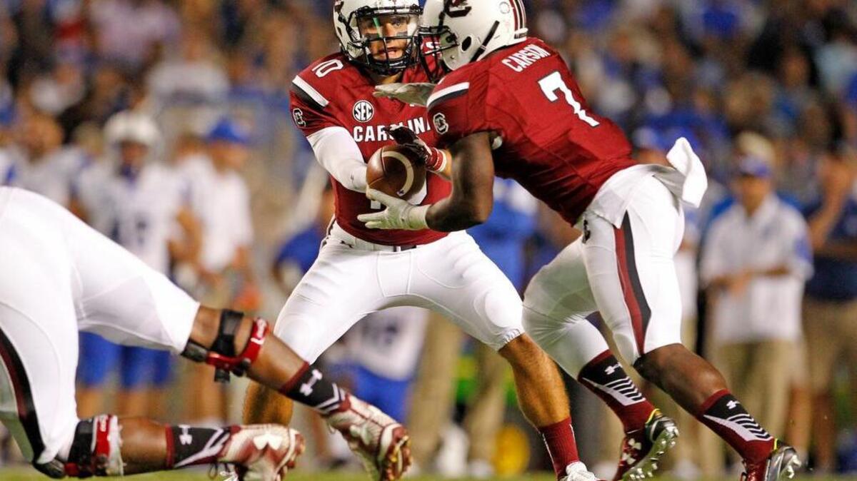 
South Carolina quarterback Perry Orth (10) and running back Shon Carson (7)
