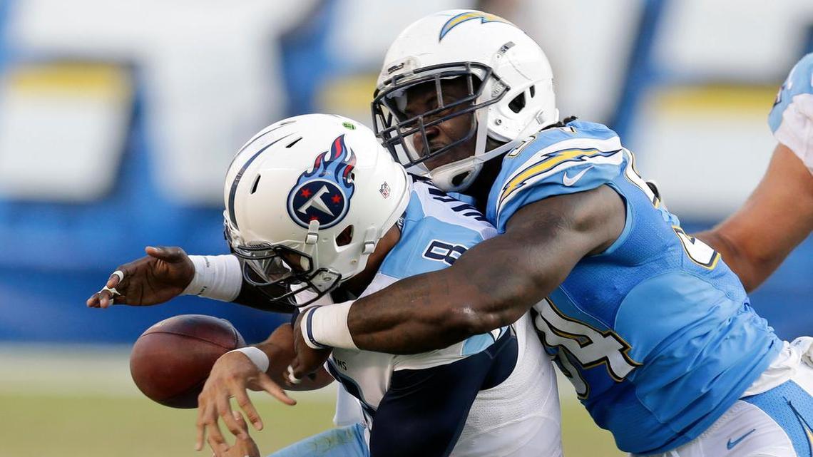 San Diego Chargers outside linebacker Melvin Ingram, a former Gamecock, knocks the ball away from Tennessee Titans quarterback Marcus Mariota this past season.