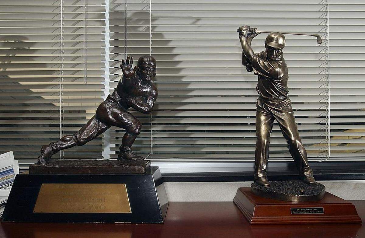 USC football coach Steve Spurrier's office at Williams-Brice Stadium has mementos from his years in coaching. HERE> Spurrier's 1966 Heisman Trophy and ProAm Golf trophy he won with Hale Irwin during the 2005 Bruno's Memorial Classic in Birmingham Al.