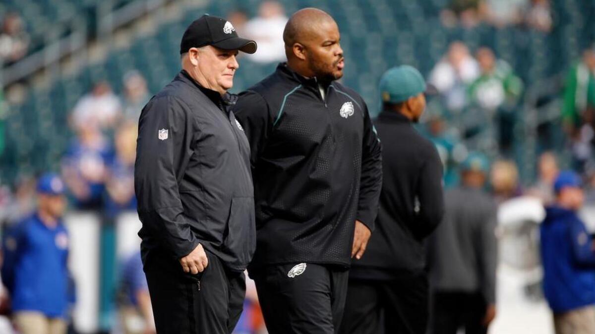 Philadelphia Eagles running backs coach Duce Staley, right, with recently-fired coach Chip Kelly