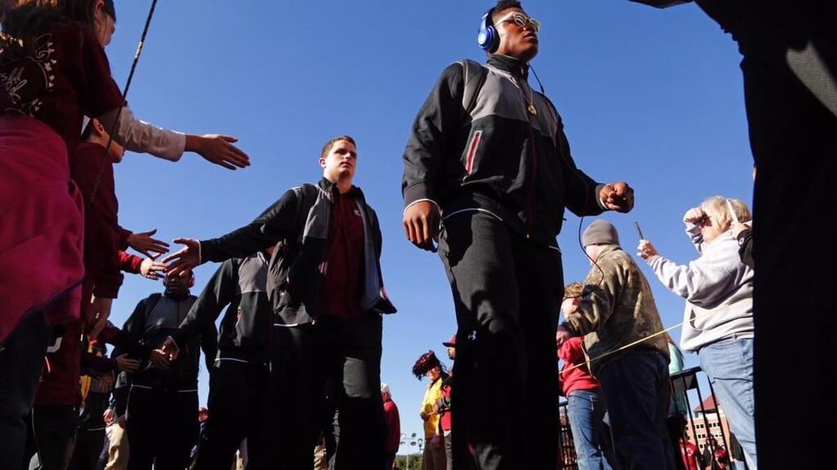 South Carolina’s Pharoh Cooper and Kyle Markway take part in the Gamecock Walk toward Williams-Brice Stadium, Saturday, November 21, 2015.