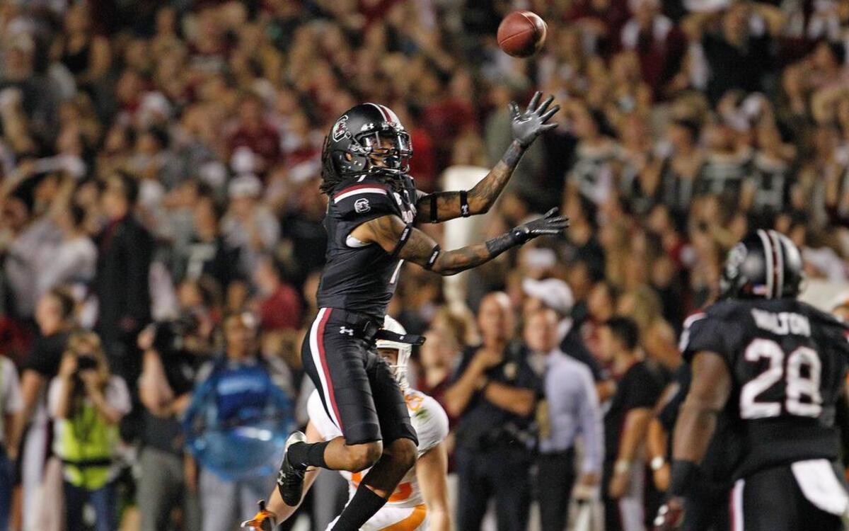 South Carolina Gamecocks defensive back Jamarcus King (7) intercepts Tennessee Volunteers quarterback Joshua Dobbs (11) in the fourth quarter at Williams-Brice Stadium in Columbia.