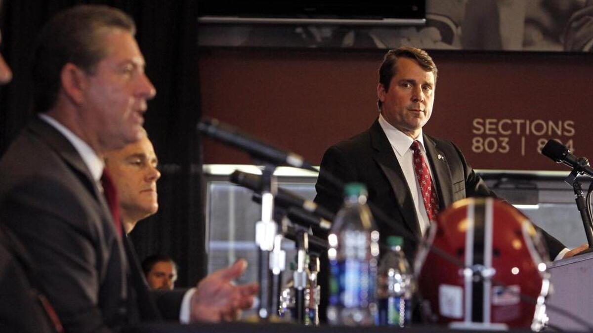Ray Tanner, left, USC’s athletic director, talks about new head football coach Will Muschamp inside Williams-Brice Stadium, Monday.