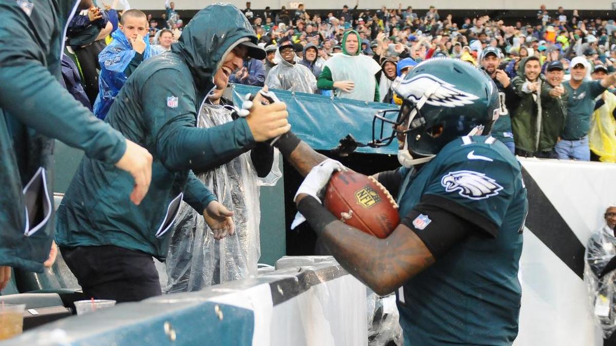 Philadelphia Eagles wide receiver Alshon Jeffery (right) celebrates his touchdown catch with Los Angeles Angels of Anaheim outfielder Mike Trout (left) in the third quarter against the San Francisco 49ers at Lincoln Financial Field.