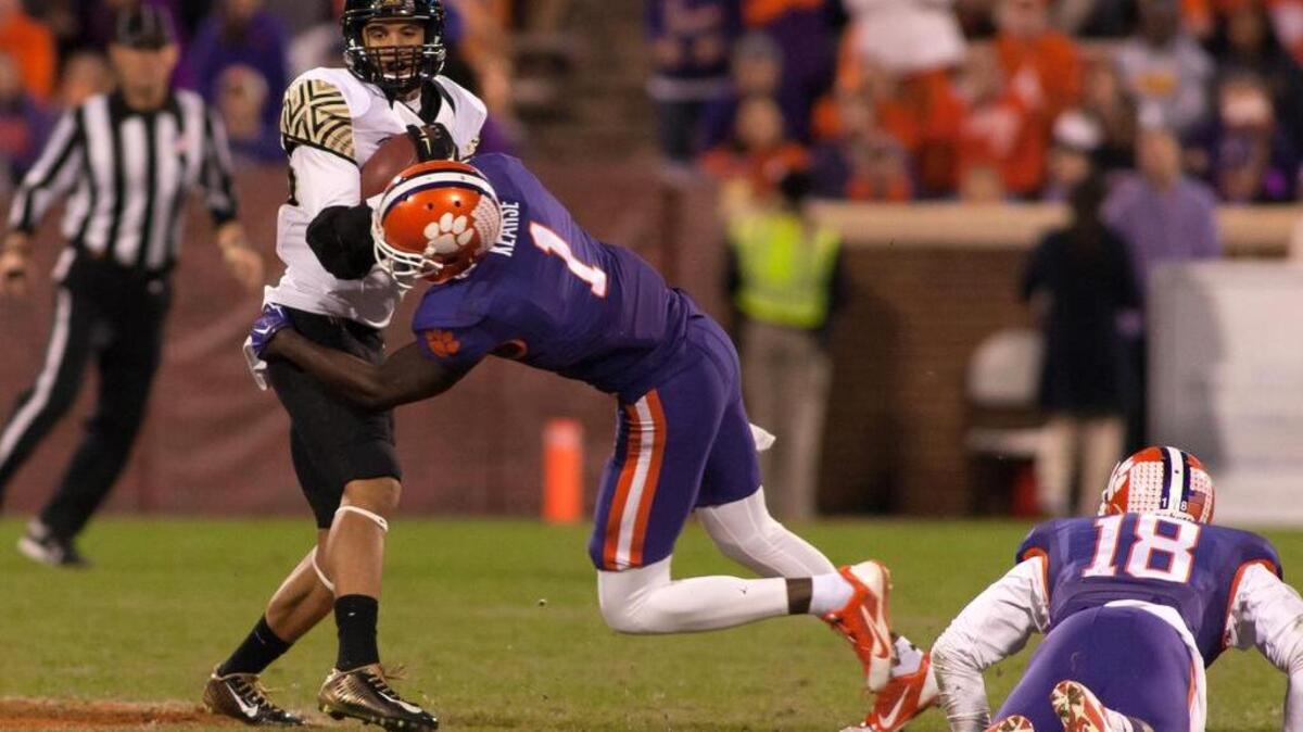 Former South Carolina receiver K.J. Brent, left, gets tackled by Jayron Kearse. Brent is Wake Forest’s top receiver.