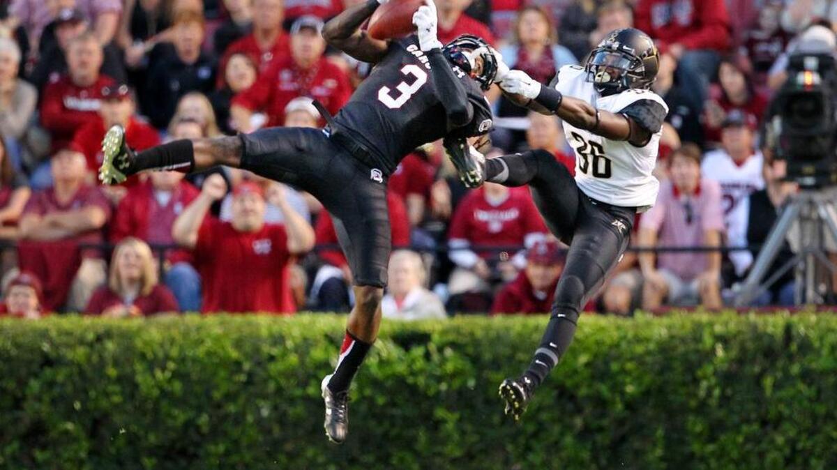 Gamecocks cornerback Chris Lammons intercepts a ball intended for Vanderbilt Commodores wide receiver Trey Ellis.