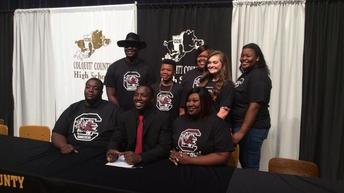 Kiel Pollard and family on signing day