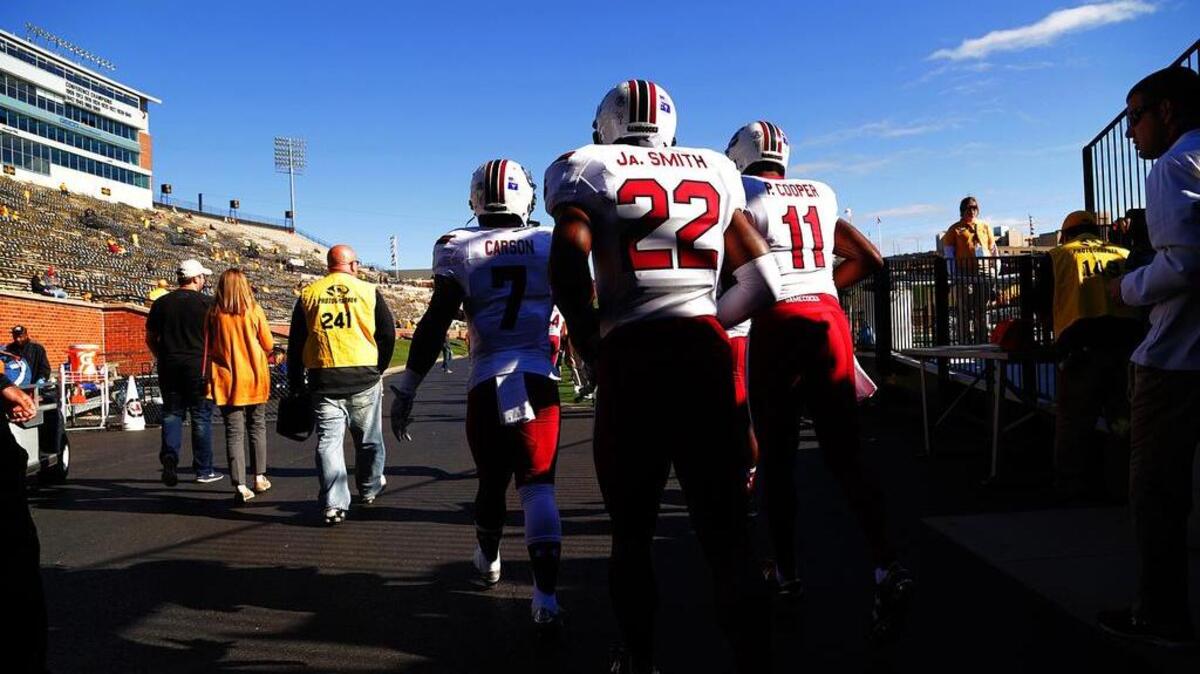 
South Carolina Gamecocks running back Shon Carson (7), cornerback Jamari Smith (22) and wide receiver Pharoh Cooper (11) head onto the field Saturday in Missouri.
