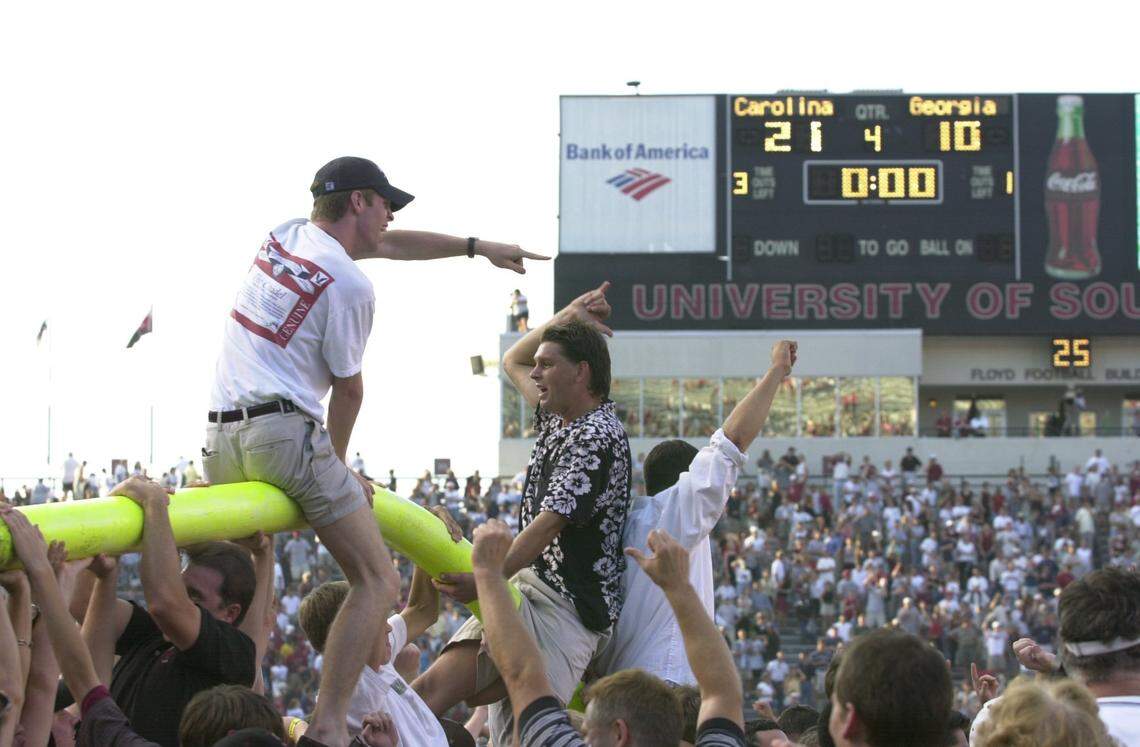 Gamecock fans hang off what's left of the goal posts after South Carolina's upset victory over Georgia in the 2000 season.