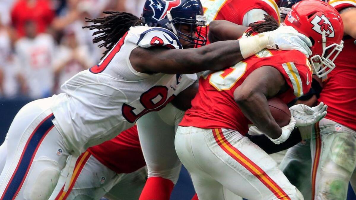 
Houston Texans outside linebacker Jadeveon Clowney (90) tackles Kansas City Chiefs running back Jamaal Charles (25) on Sunday.
