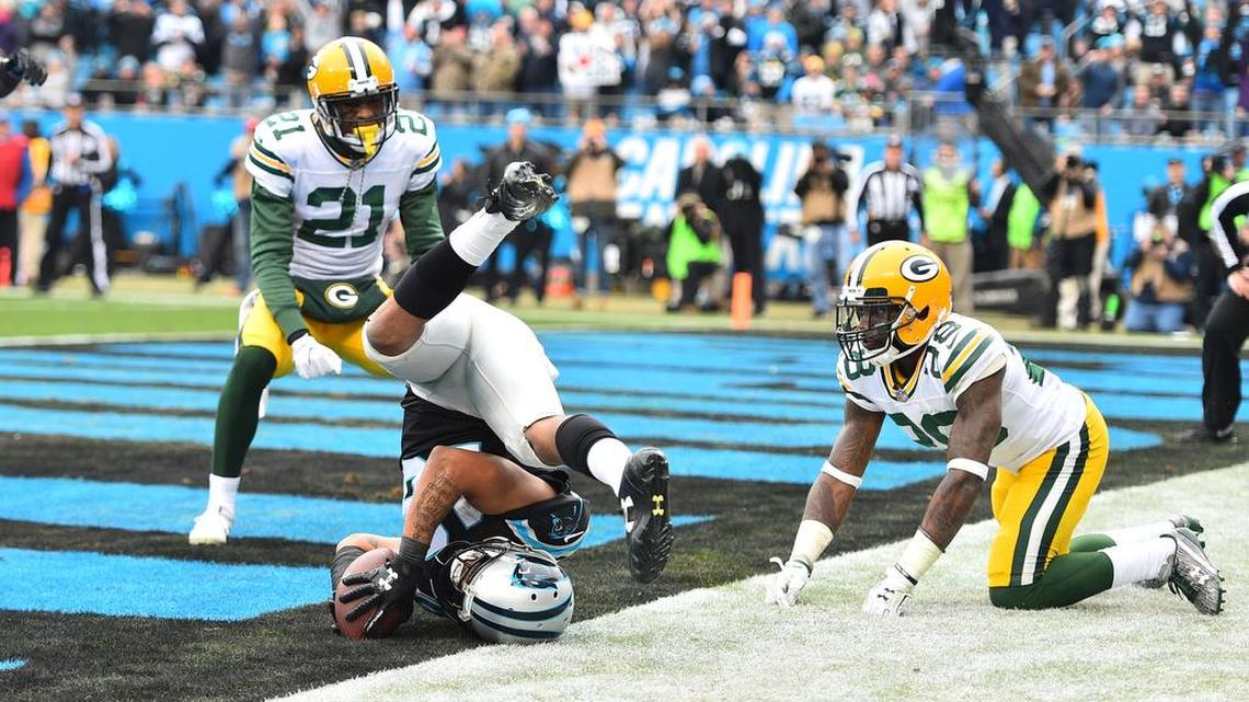 Carolina Panthers wide receiver Damiere Byrd (18) catches a touchdown as Green Bay Packers free safety Ha Ha Clinton-Dix (21) and cornerback Josh Hawkins (28) defend in the third quarter at Bank of America Stadium.