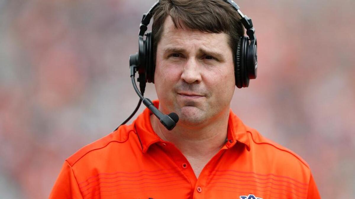 FILE - In this April 18, 2015, file photo, Auburn defensive coordinator Will Muschamp walks around the football field in the first quarter of their spring NCAA college football game in Auburn, Ala. A person with direct knowledge of the decision says Muschamp has agreed to become South Carolina’s next head football coach, and he could be formally introduced as early as Monday, Dec. 7, 2015.