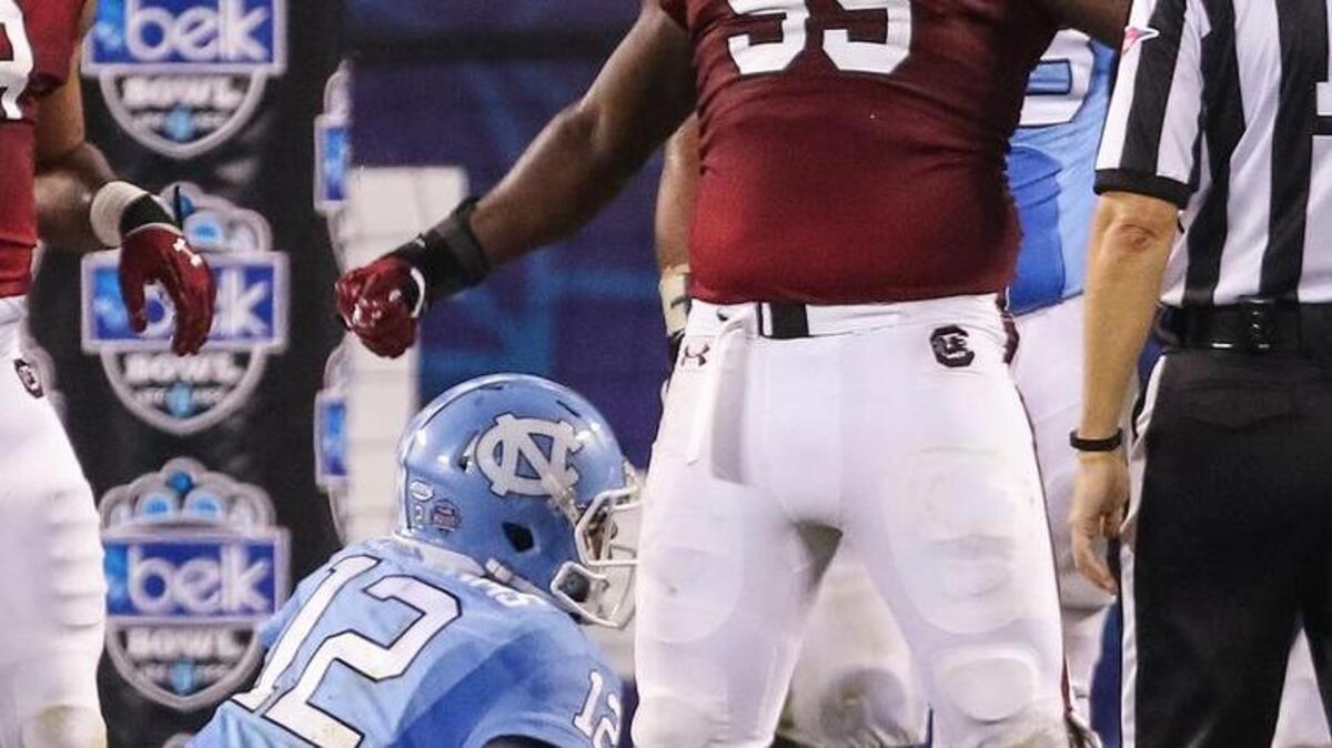 
South Carolina defensive end Dante Sawyer celebrates a sack of North Carolina quarterback Marquise Williams (12) near the end zone during Thursday’s victory over the Tarheels at Bank of America Stadium in Charlotte.

