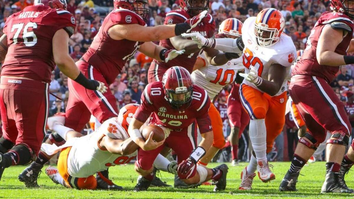 South Carolina quarterback Perry Orth (10) is sacked by Clemson defensive end Kevin Dodd (98) Saturday.