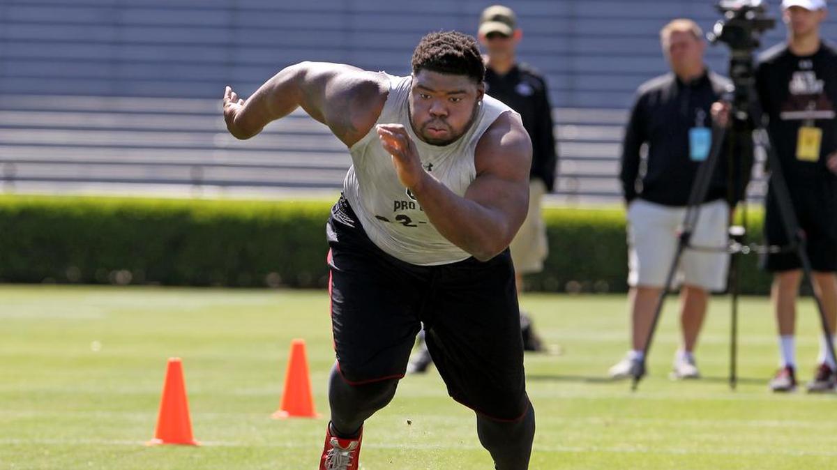 South Carolina Gamecocks defensive tackle Gerald Dixon Jr. (92) runs through a drill during USC Pro Day at Williams-Brice Stadium in 2016.