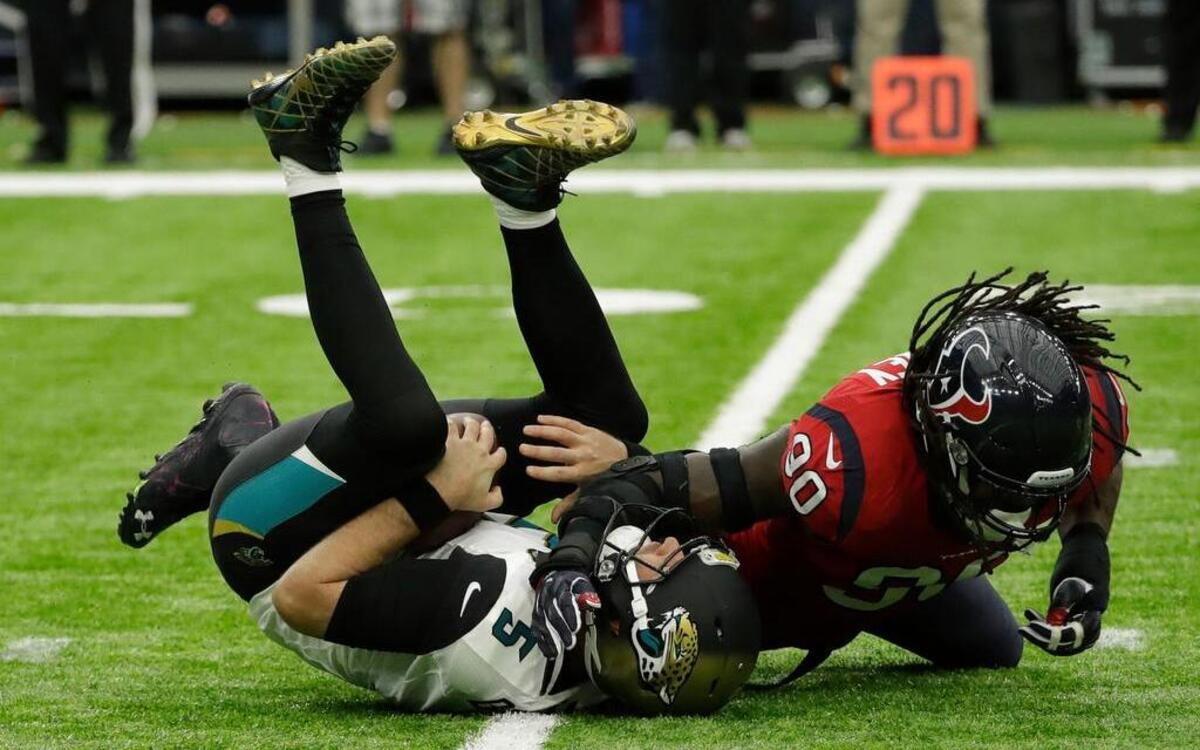 Houston’s Jadeveon Clowney (90) sacks Jacksonville quarterback Blake Bortles.