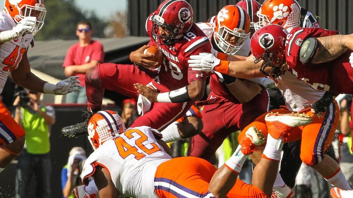 South Carolina quarterback Lorenzo Nunez (19) is stopped short by the Clemson defense during the USC-Clemson game Saturday at Williams-Brice Stadium.
