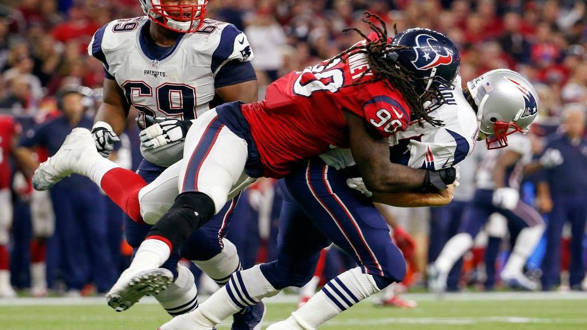 Houston Texans outside linebacker Jadeveon Clowney (90) sacks New England Patriots quarterback Tom Brady (12)