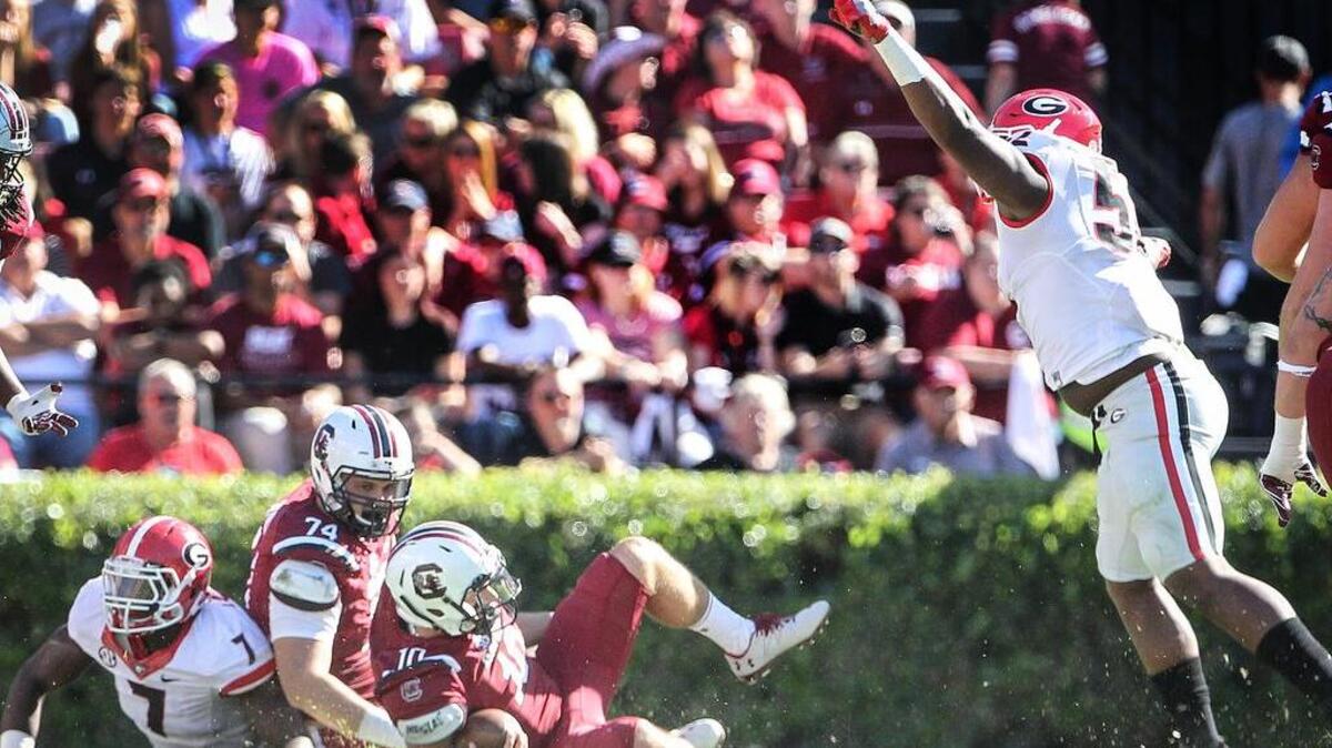 USC quarterback Perry Orth is sacked during the Gamecocks’ loss to Georgia on Sunday.