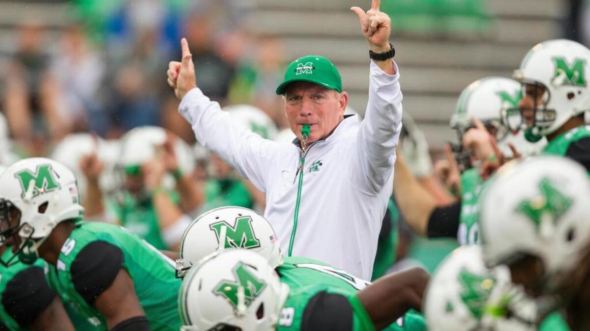 Marshall Thundering Herd head coach Doc Holliday coaches his team during warmups before the game against the North Texas Mean Green at Joan C. Edwards Stadium.