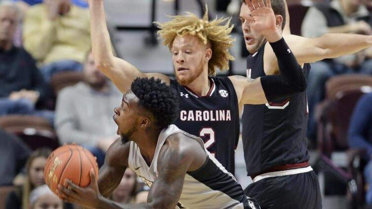 Providence’s Makai Ashton-Langford (1) looks for a shot over South Carolina’s Hassani Gravett (2) in the first half of an NCAA college basketball game, Saturday, Nov. 17, 2018, in Uncasville, Conn. (AP Photo/Stephen Dunn)