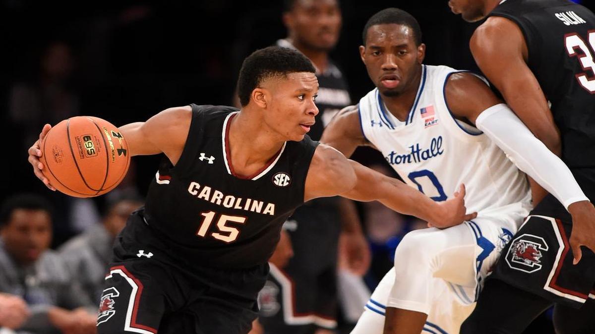 South Carolina’s PJ Dozier drives around Seton Hall’s Khadeen Carrington in the first half Monday.