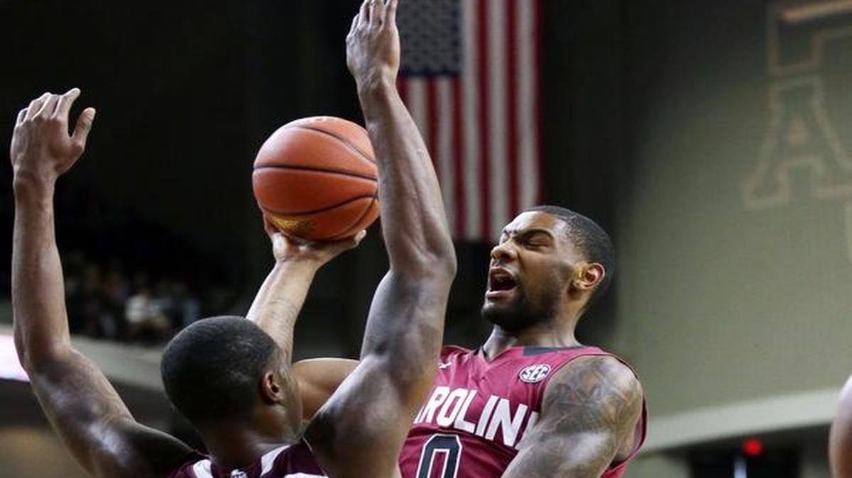 South Carolina guard Sindarius Thornwell (0) goes against Texas A&M Aggies guard Jalen Jones (12) at Reed Arena on Saturday.
