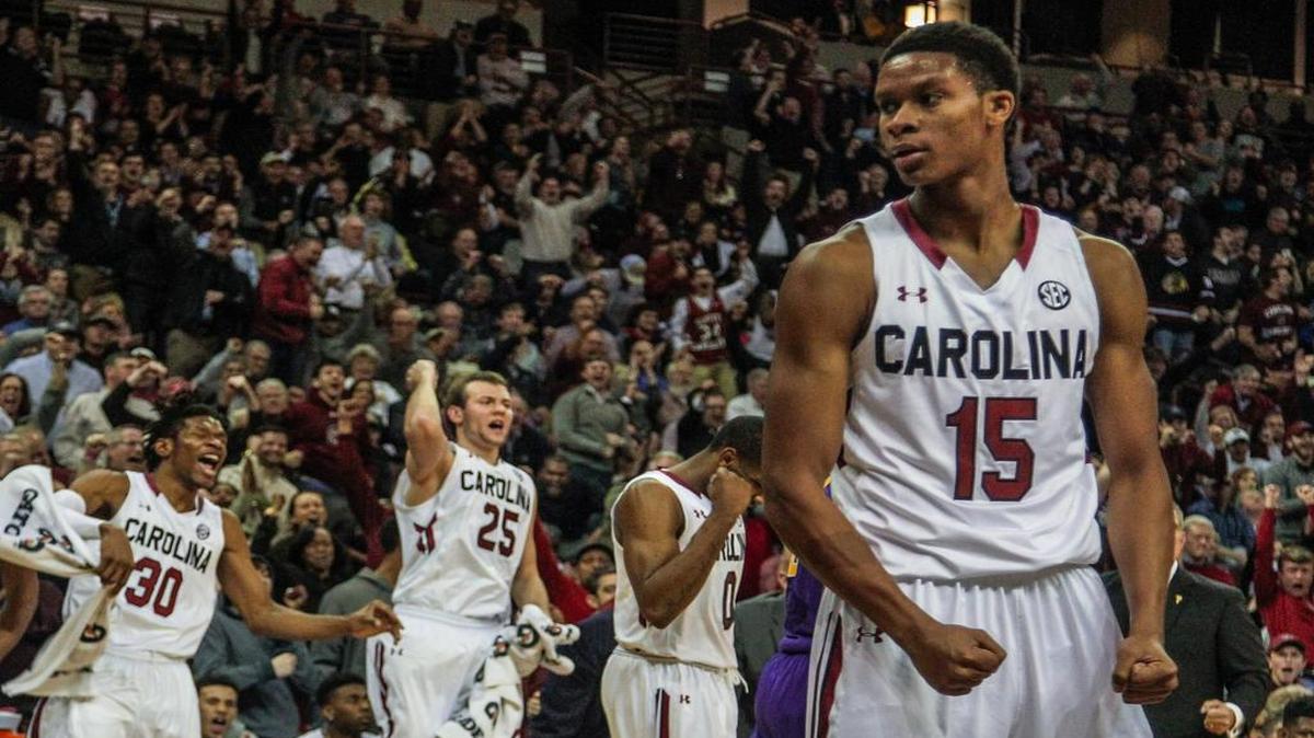 South Carolina's Chris Silva (30) Mindaugas Kacinas (25) and Sindarius Thornwell (0) celebrate as University of South Carolina's PJ Dozier (15) draws a foul against LSU.