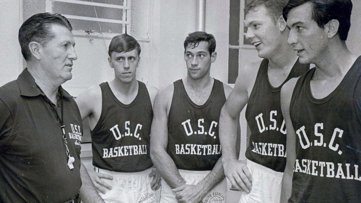Frank McGuire, left, coaches four of the players including Jack Thompson, second from left, and Skip Harlicka, center. They were part of of the 1965 USC team that beat Duke.