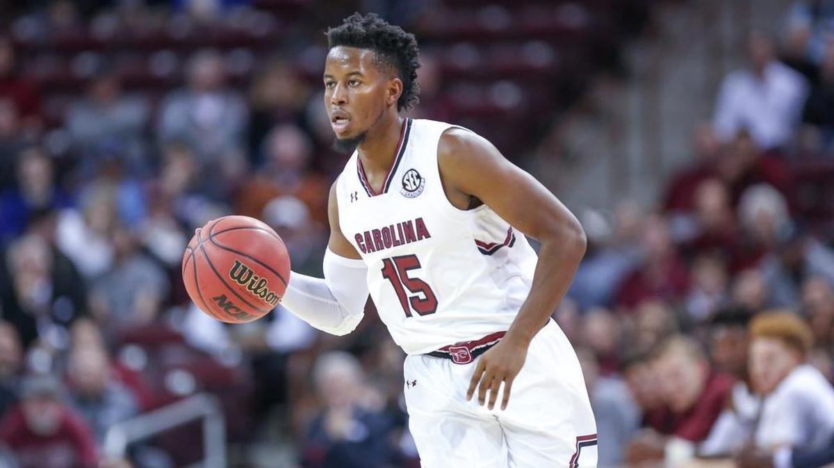 South Carolina's Wesley Myers (15) brings the ball upcourt.