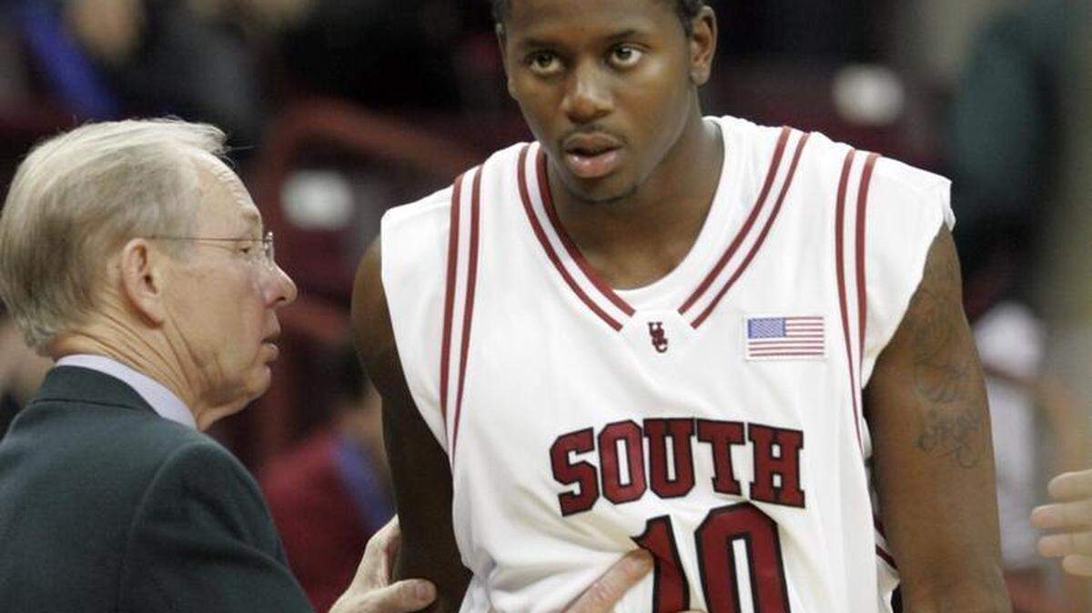 South Carolina coach Dave Odom gives Chad Gray (10) instructions as he prepares to enter the game against Princeton in the final seconds of a basketball game Wednesday, Dec. 20, 2006, in Columbia, S.C. South Carolina won 54-48.