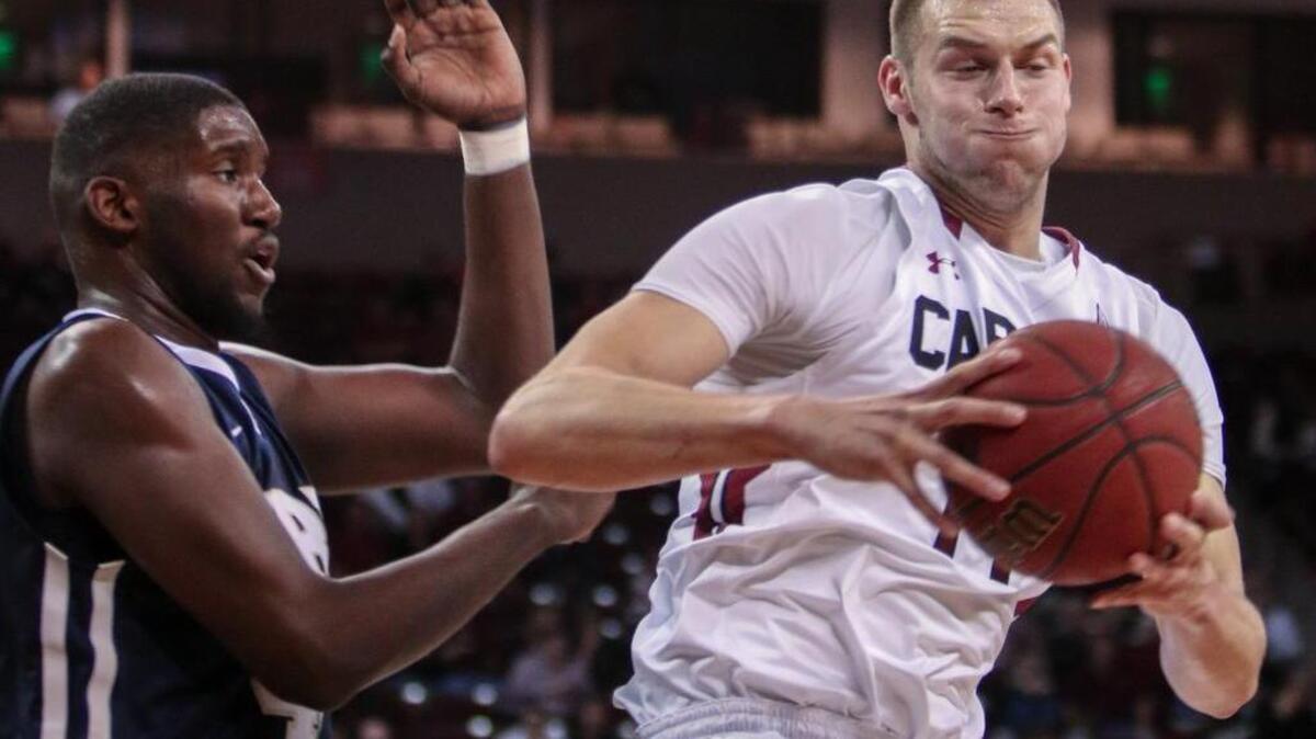 South Carolina's Laimonas Chatkevicius (14) pulls down a rebound over Oral Roberts' Albert Owens (44) during the first half of action in the Colonial Life Arena.