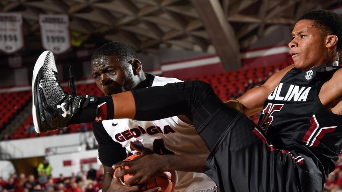 PJ Dozier, right, and the Gamecocks play Georgia inside Stegeman Coliseum on Wednesday night.
