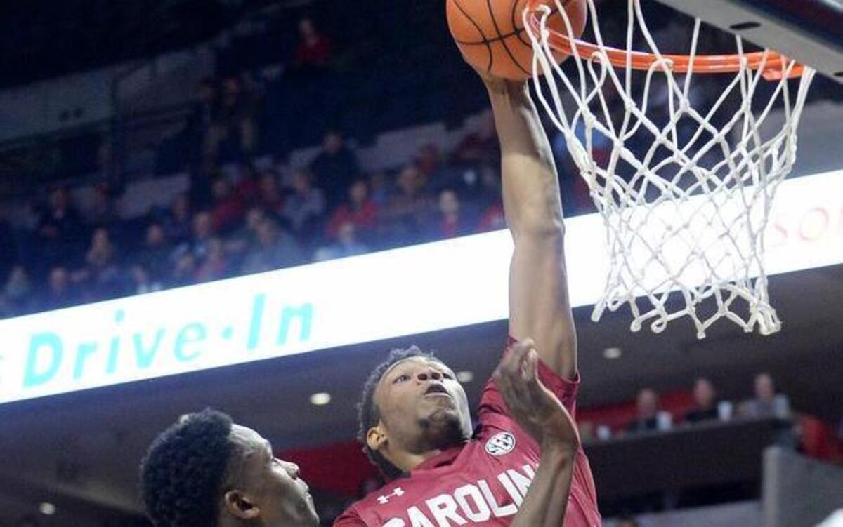 South Carolina’s Jamall Gregory dunks the ball over Mississippi’s Marcanvis Hymon during the second half of the Gamecocks’ 77-74 overtime win on Tuesday.
