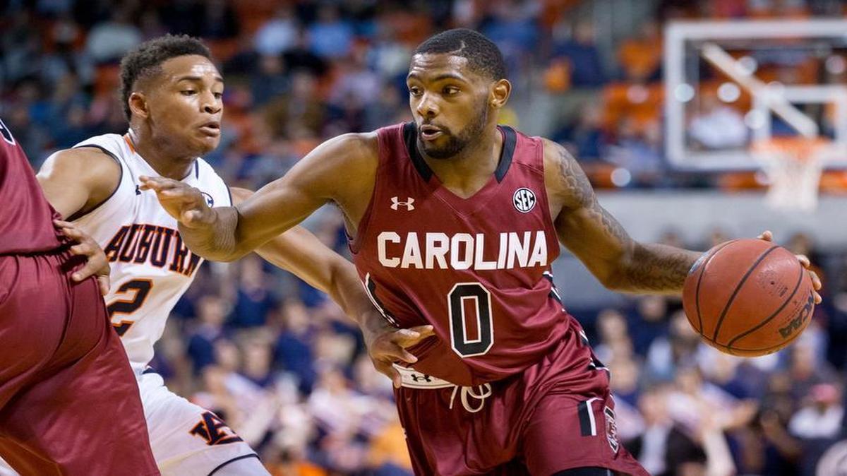 South Carolina guard Sindarius Thornwell (0) drives against Auburn guard Bryce Brown (2) during their game Tuesday in Auburn, Ala.