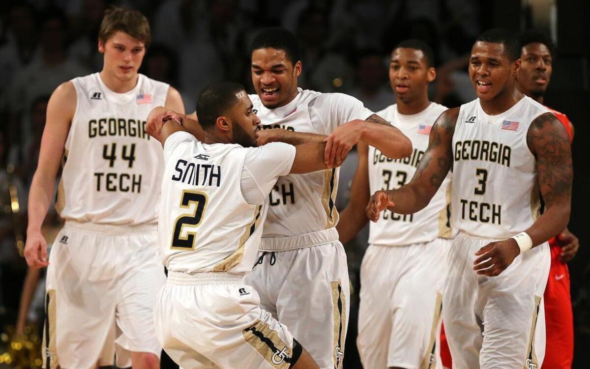 Georgia Tech guard Adam Smith is pulled up from the floor by Tadric Jackson after he hit a 2-pointer and was fouled during an NCAA college basketball game against Houston in the first round of the NIT on Wednesday, March 16, 2016, in Atlanta.