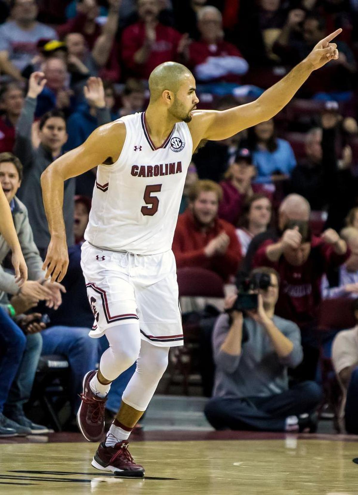 South Carolina Gamecocks guard Frank Booker (5) celebrates a three pointer against the Coastal Carolina Chanticleers.