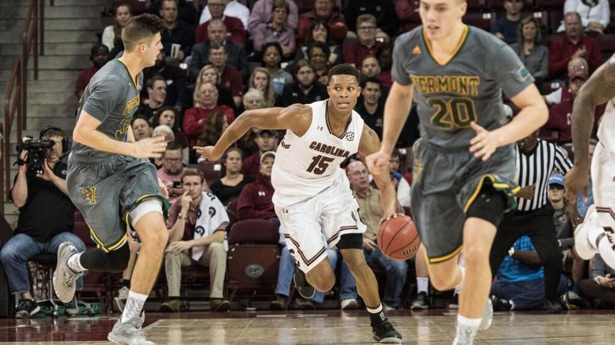 USC's PJ Dozier (15) makes his way to the bucket during their game against Vermont.