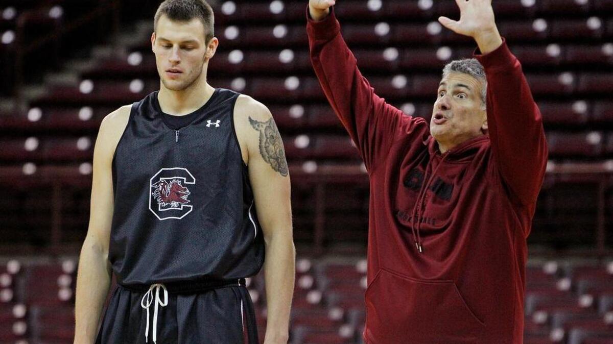 South Carolina basketball coach Frank Martin directs Laimonas Chatkevicius in practice.