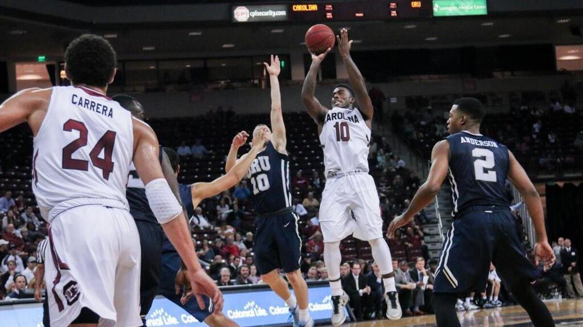 South Carolina's Duane Notice (10) shoots over Oral Roberts's Jalen Bradley (10)