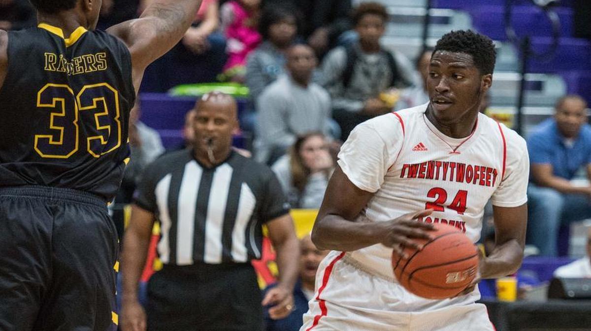 University of South Carolina signee and 22ft Academy forward Sedee Keita (24) drives to the hoop against LeMarcus Johnson (33) of Keenan at the Bojangles Bash Thursday night at Ridge View High School.