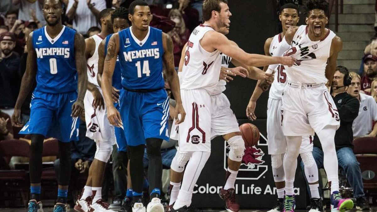 South Carolina forward Chris Silva, right, celebrates with teammates against Memphis on Saturday at Colonial Life Arena.