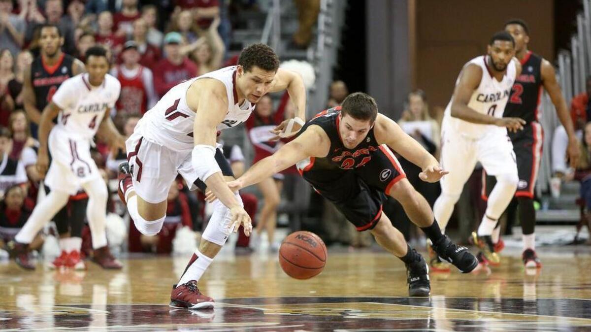 South Carolina's Michael Carrera (24) battles Georgia's Houston Kessler