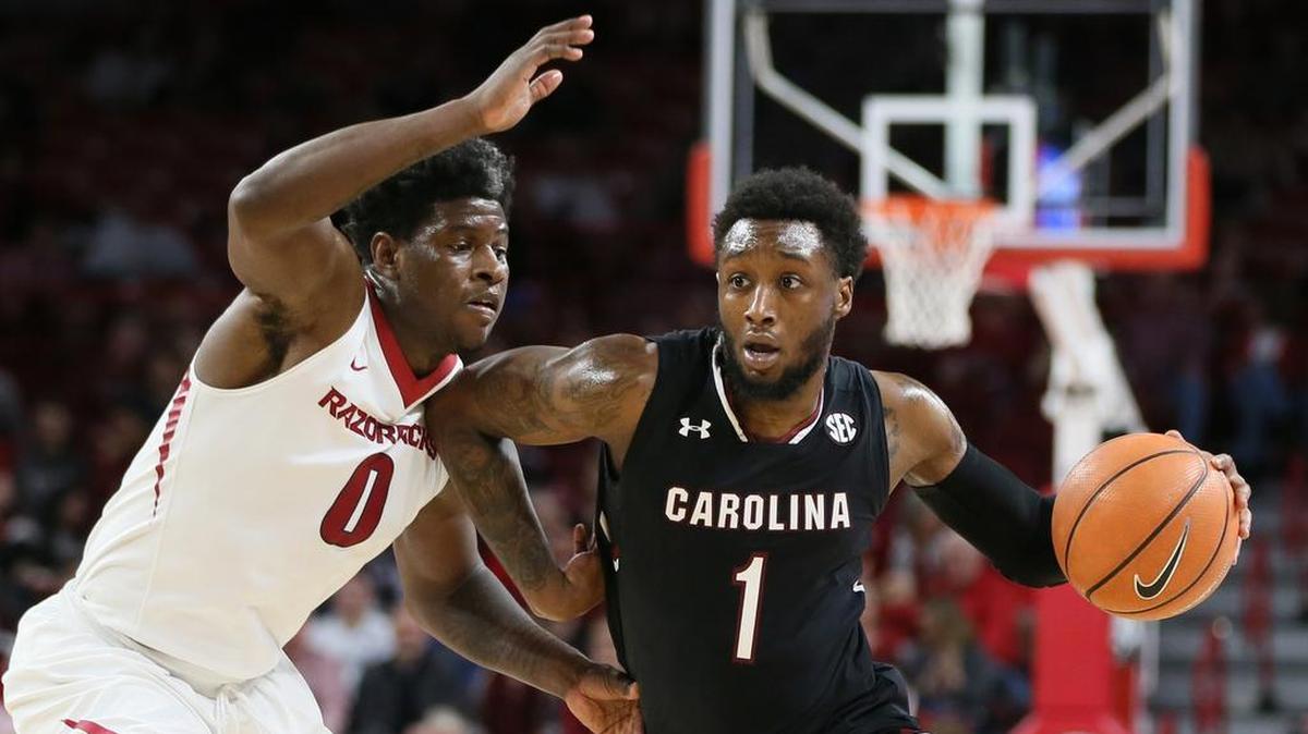 South Carolina Gamecocks guard Kory Holden (1) drives against Arkansas Razorbacks guard Jaylen Barford (0) in the game at Bud Walton Arena.