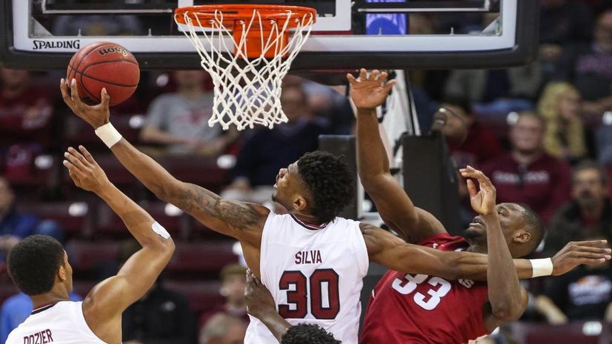 South Carolina Gamecocks forward Chris Silva (30) grabs a rebound over Arkansas Razorbacks forward Moses Kingsley (33)