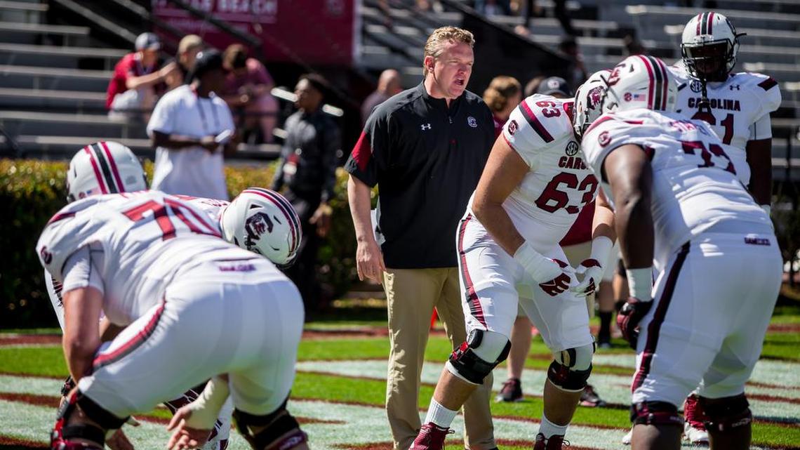 Offensive line coach Eric Wolford works with his linemen before the USC Spring Game at Williams-Brice Stadium.