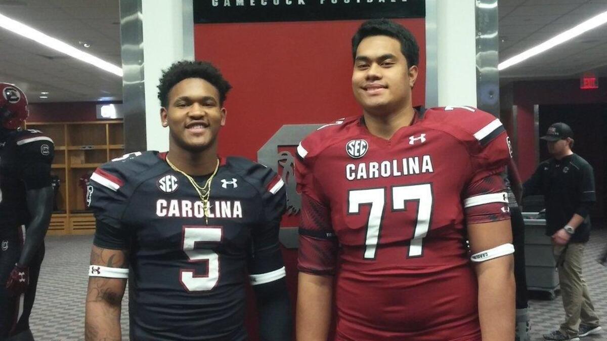 Running back Rico Dowdle and offensive lineman Pete Leota, both USC commitments from Asheville, NC.
