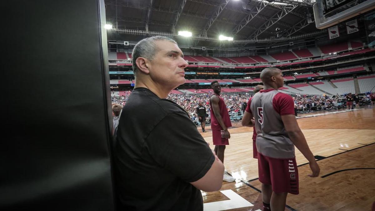 Frank Martin and PJ Dozier on the court for practice at the university of Phoenix Stadium.