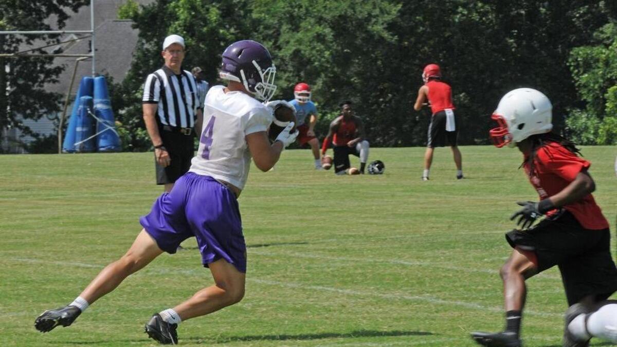 Northwestern’s Logan Rudolph makes a catch against Clinton in 7-on-7 action.